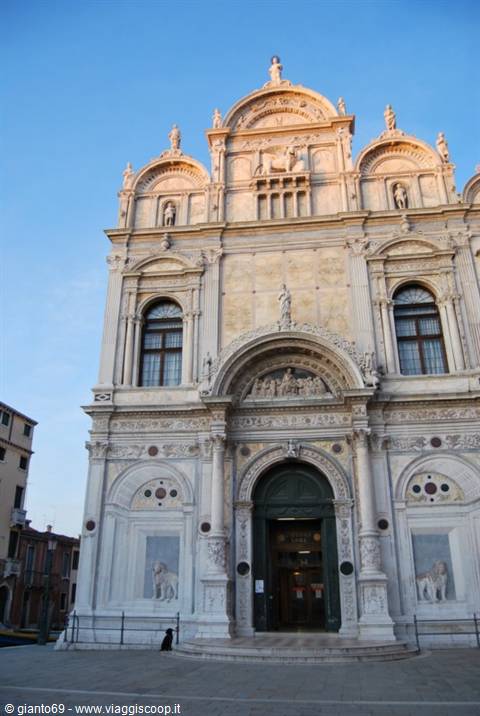Marble facade of Santa Maria dei Miracoli church in Venice, golden light