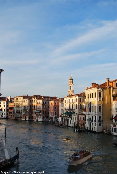Ancient palaces overlook Venice's Grand Canal as a boat crosses the water