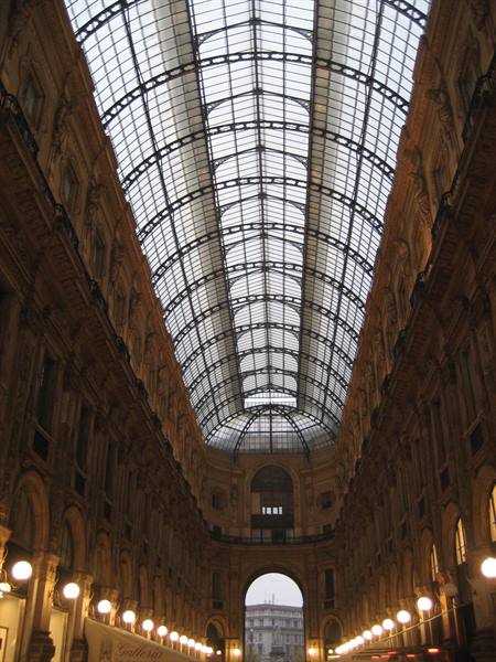 Galleria Vittorio Emanuele II in Milan, glass and iron vault lit by lamps