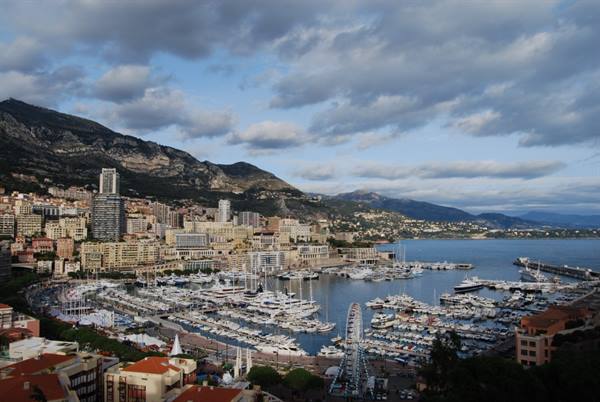Monte Carlo harbor filled with yachts under a cloudy sky