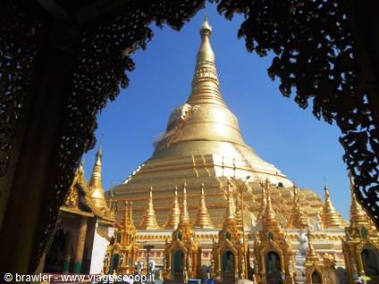 Shwedagon golden stupa framed by a carved archway, Yangon