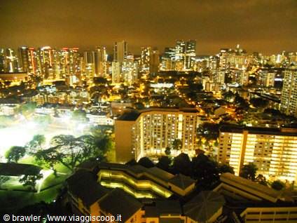 Illuminated skyscrapers at night in Singapore seen from above