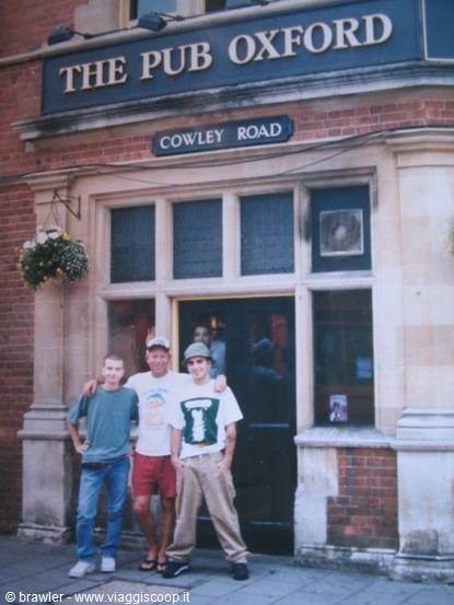 Three friends under the Oxford Pub sign on Cowley Road