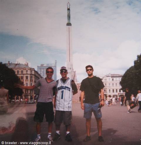 Three friends in front of Riga's Freedom Monument