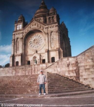 Tourist posing on the steps of Santa Luzia Sanctuary in Viana do Castelo