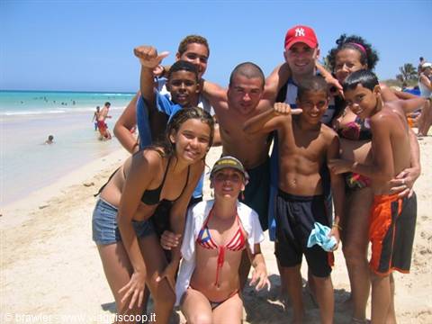 Group of locals and tourist posing on Varadero beach
