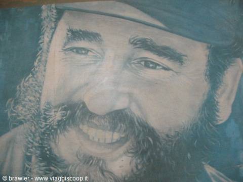 Mural of Fidel Castro's smiling face with cap and beard