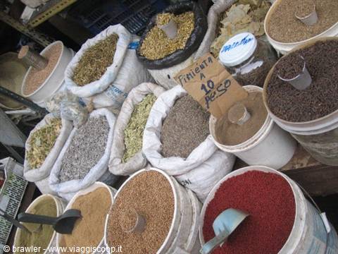 Colorful spice sacks at the market, Trifongo sign for 10 pesos