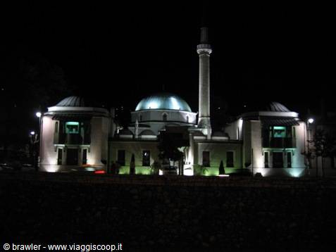 Emperor's Mosque at night in Sarajevo, illuminated green dome and minaret