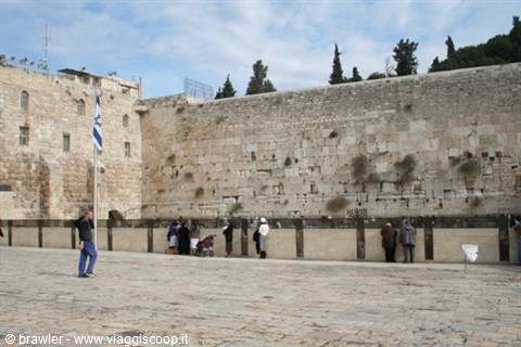 Worshippers pray at the stone blocks of the Western Wall, Jerusalem