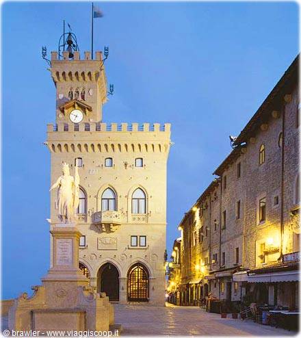 Stone government palace illuminated at dusk, Piazza della Libertà, San Marino