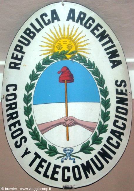 Enamel sign of Republica Argentina postal service, sun and clasped hands emblem