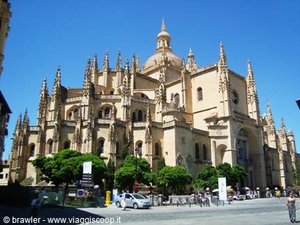 Segovia Gothic Cathedral, spires and dome in pale stone under blue sky