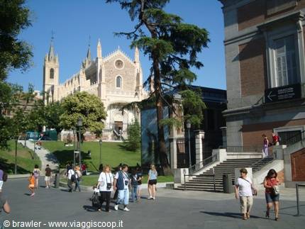 Tourists walking past the Church of San Jerónimo el Real and the Prado Museum in Madrid