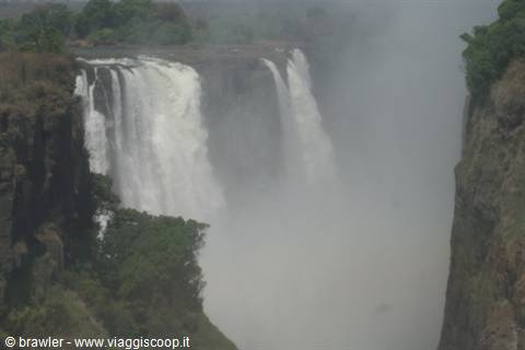 Victoria Falls: powerful waterfalls over basalt cliffs, mist rising through the gorge