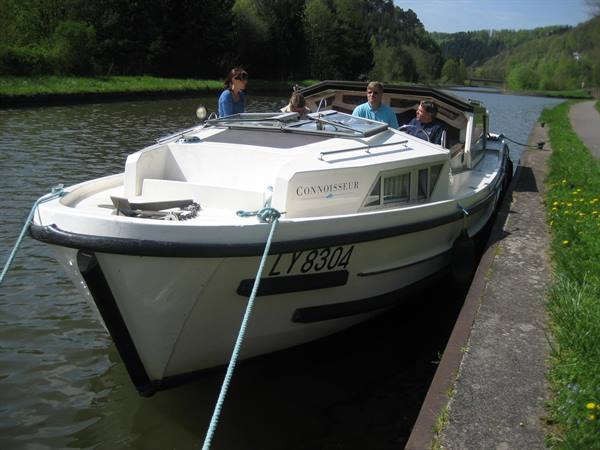 Connoisseur LY8304 motorboat moored along a canal with four people on board