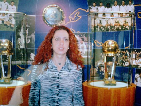 Red-haired woman among European Cups at Real Madrid museum