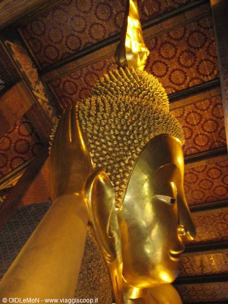 Golden head of the Reclining Buddha at Wat Pho temple, Bangkok