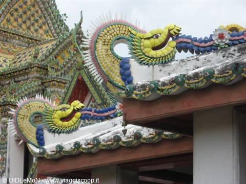 Colorful ceramic dragons on the roofs of Wat Pho, Bangkok