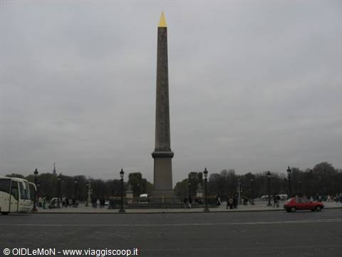 Luxor Obelisk with golden tip at Place de la Concorde, grey sky