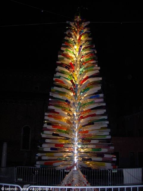 Christmas tree of colored Murano blown glass, illuminated at night in Venice