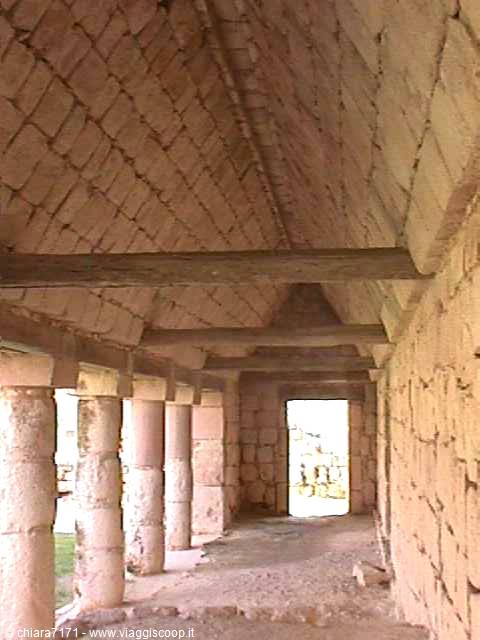 Mayan stone colonnade with corbelled vault and wooden lintels