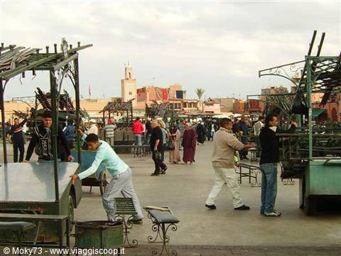 Marrakech, Jemaa el-Fna square: vendors set up iron stalls among the crowd
