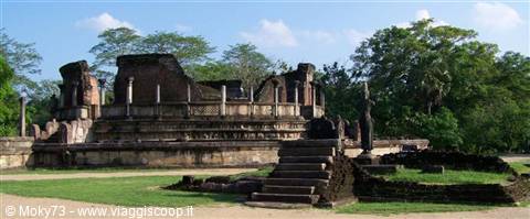 Ancient stone ruins at Polonnaruwa, stairs and columns among green trees
