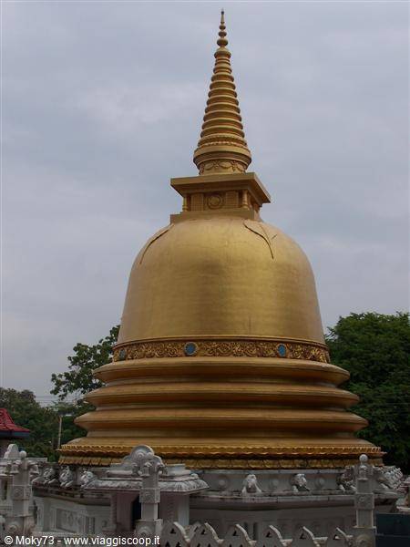 Golden stupa of Dambulla Golden Temple under cloudy sky
