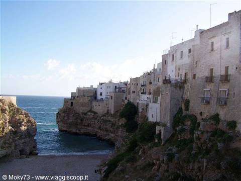White houses of Polignano a Mare above the cliff and beach