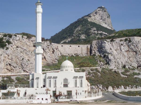 White Ibrahim-al-Ibrahim Mosque with minaret beneath the Rock of Gibraltar