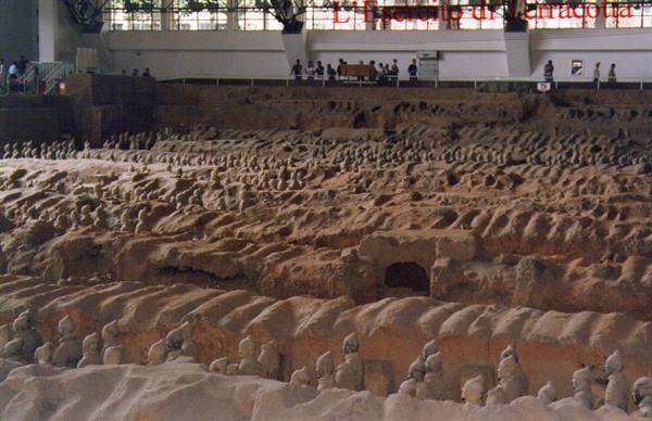 Terracotta Army statues in excavated earthen trenches under Xi'an museum hall