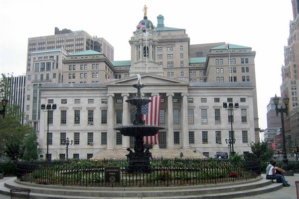 Cast iron fountain in front of Brooklyn Borough Hall with American flag