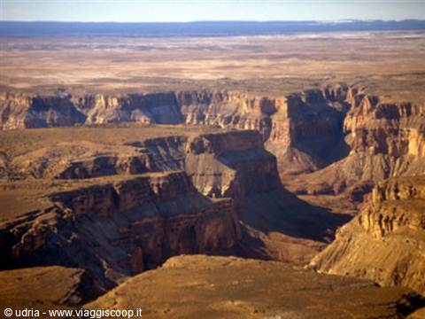 Orange rock walls of the Grand Canyon under morning light