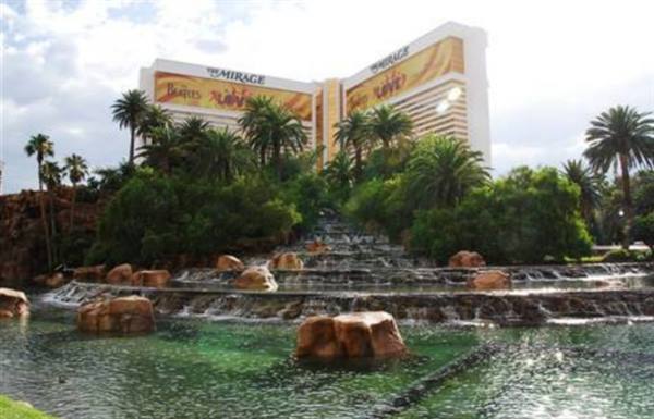 Man-made waterfalls and palm trees in front of The Mirage hotel, Las Vegas