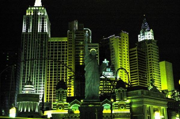 Replica Statue of Liberty before illuminated skyscrapers of New York-New York hotel, Las Vegas
