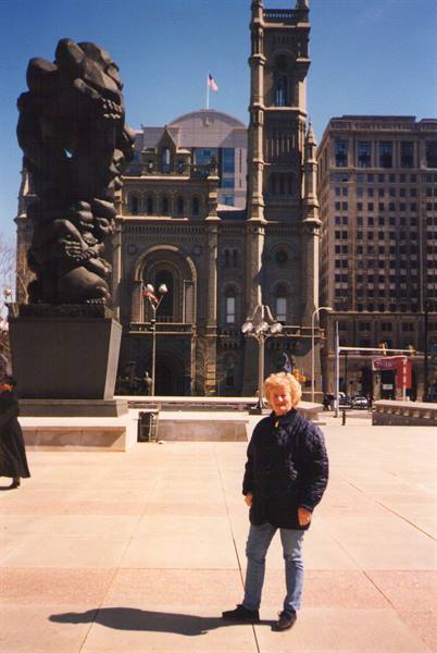 Woman in front of Philadelphia City Hall and Lipschitz sculpture, afternoon sun