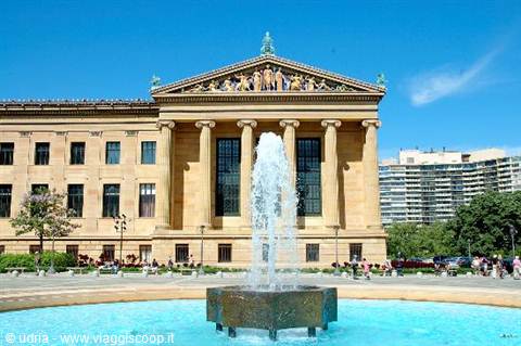 Fountain in front of the Philadelphia Museum of Art, golden stone facade