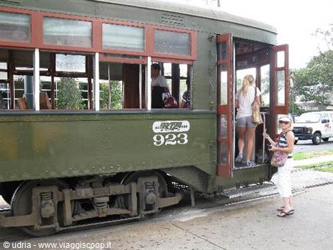 Tourists boarding the green historic streetcar number 923, St. Charles line