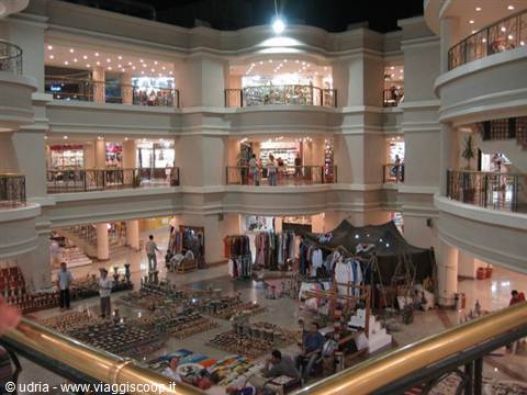 Souvenir market stalls inside a multi-level shopping mall