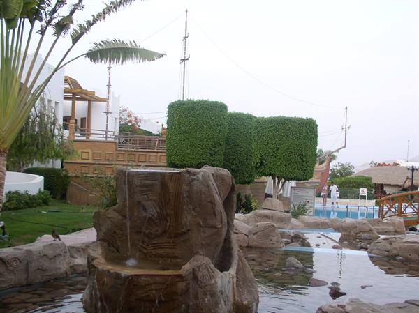 Artificial rock fountain with pools and gardens at a tourist resort