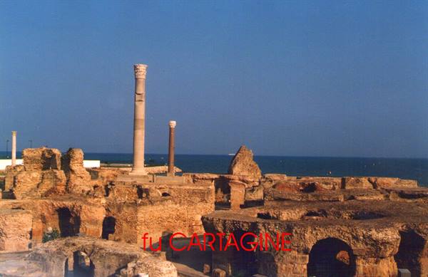Roman stone columns among ancient bath ruins by the sea, Carthage