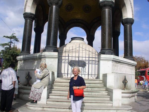 Woman with red bag in front of the German Fountain, Istanbul