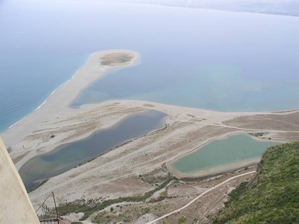 Sandy spit and turquoise lagoon waters seen from above