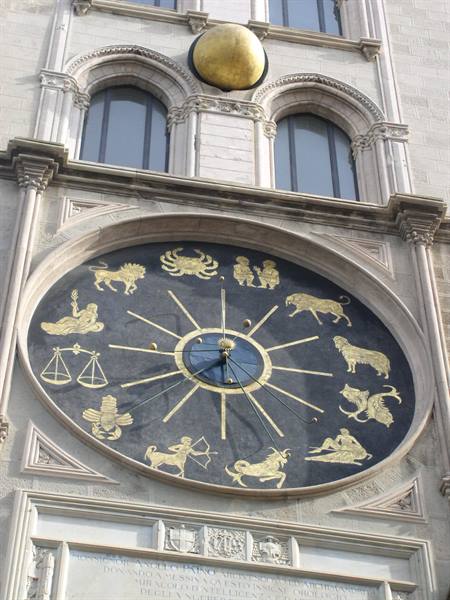 Golden astronomical clock with zodiac signs on the Torre dell'Orologio, Brescia