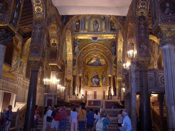 Tourists admire the golden Byzantine mosaics in the Palatine Chapel apse