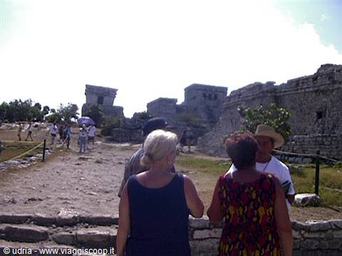 Tourists among the Mayan ruins of Tulum under the sun