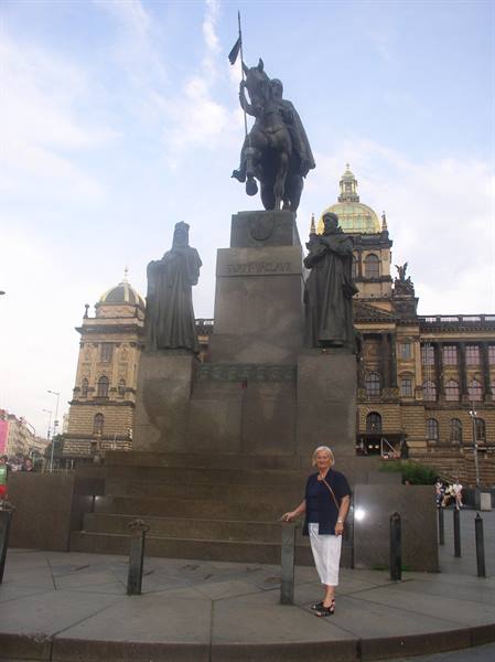 Woman beside the Jan Hus memorial on Prague's Old Town Square
