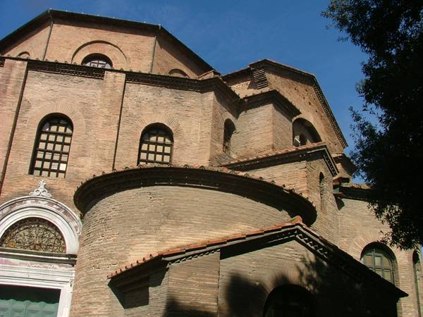 Brick apse of San Vitale Basilica in Ravenna under blue sky