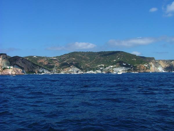 Boats on the sea in front of Ponza's green hills